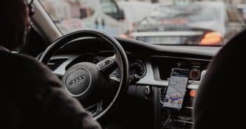 man in black jacket driving car during daytime