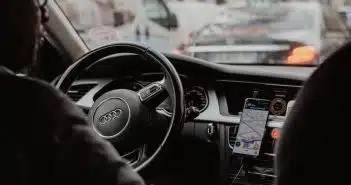 man in black jacket driving car during daytime