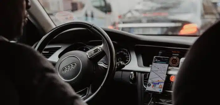 man in black jacket driving car during daytime