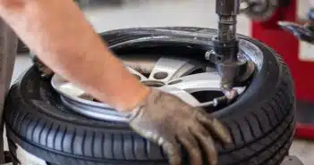 person holding black and gray metal tool