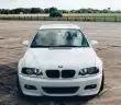 white bmw car on road during daytime