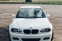 white bmw car on road during daytime
