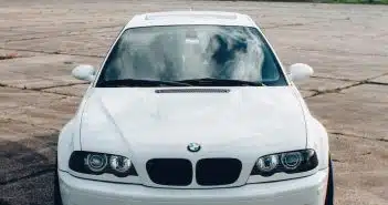 white bmw car on road during daytime