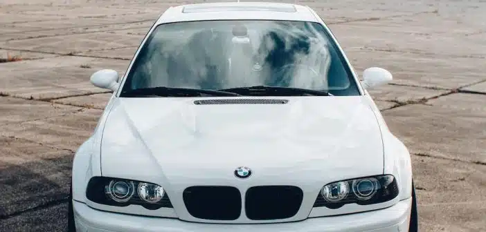 white bmw car on road during daytime