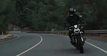 man riding motorcycle on concrete street